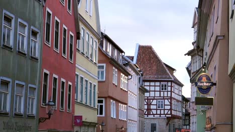 Tilt-upwards-of-crowded-alley-during-International-Samba-Festival-in-Coburg-Germany-during-evening