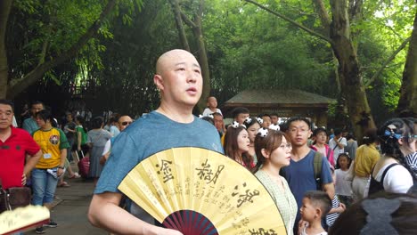 Chengdu,-China---July-2019-:-Massive-crowds-of-tourists-watching-and-photographing-cute-pandas-on-their-smartphones-in-Giant-Panda-Sanctuary