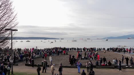 Various-drone-shots-at-English-Bay-near-downtown-Vancouver,-BC-during-Polar-Bear-2019-event