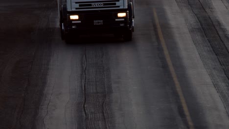 Trucks-circulate-on-a-battered-national-route