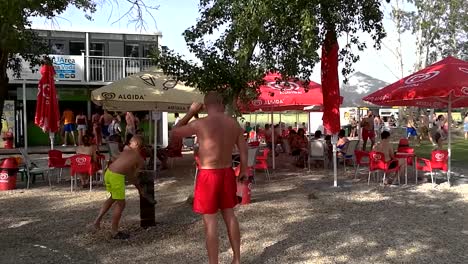 People-having-a-good-time-and-the-lakeshore-bar-and-cafe