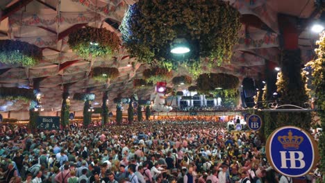 4K-UHD-timelapse-Cinemagraph-of-the-famous-beer-tent-Hofbräu-on-the-world-famous-Munich-Oktoberfest---Wiesn-with-a-seamless---endless-loop-of-Aloisius-turning-above-the-dancing-crowd