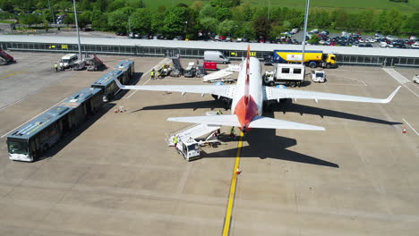 Tracking-shot-of-a-Sunwing-airplane-taxiing-to-its-arrival-terminal-gate