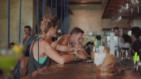 Female-Tourist-Taking-Photo-Of-Her-Food-Before-Eating-In-El-Nido-Philippines---medium-shot