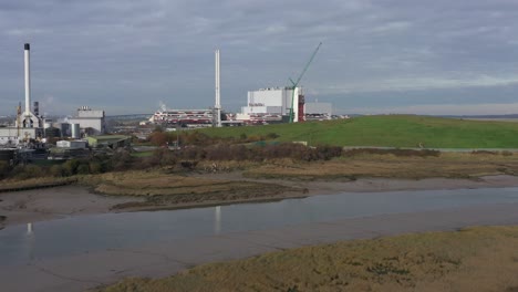 Wide-aerial-rising-establishing-shot-of-K3-Kemsley-Power-Station-under-construction-in-Sittingbourne,-UK