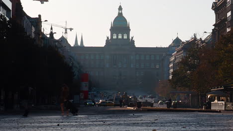 Two-tourists-walking-in-central-square-in-Prague-Czech-Republic