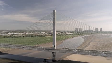 Vehicles-crossing-over-landmark-river-Mersey-gateway-bridge-aerial-view-pull-back-right