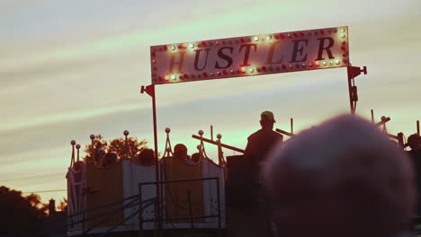 Ride-operator-stopping-Histler-carnival-ride-at-carnival