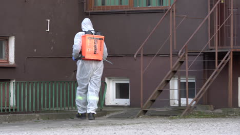 Public-service-worker-disinfects-a-stairs-handrails-in-public-space