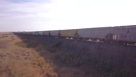 Whip-pan-follows-CP-Rail-train-as-it-passes-R-to-L-through-frame