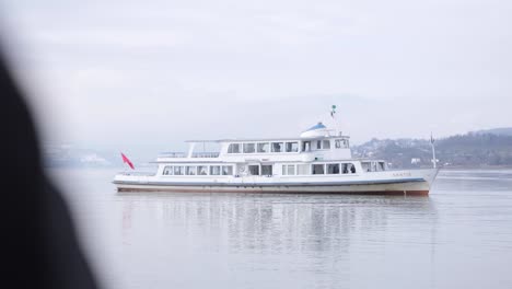 Tourist-Boat-on-Beautiful-Serene-Lake-in-Switzerland-Mountains