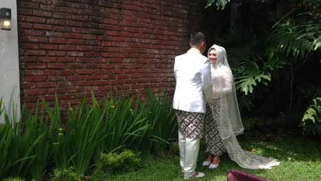 Beautiful-bride-and-groom-walking-in-the-park-before-the-wedding-ceremony