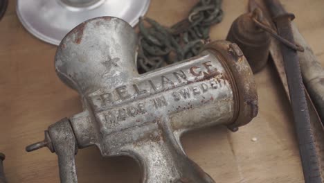 Gimbal-close-up-shot-of-used-old-hand-meat-grinder-at-Feria-Tristan-Narvaja