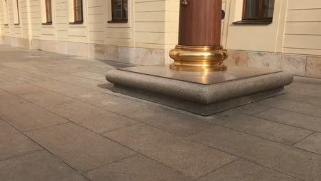 Tall-royal-flagpole-with-golden-base-in-castle-district-in-Prague