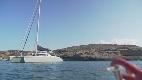 Sailing-on-a-Yacht-in-the-Mediterranean-sea-with-a-Yacht-in-the-horizon