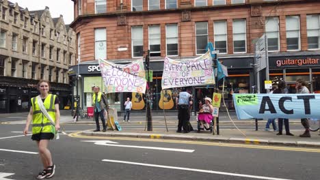 Extinction-Rebellion-protesters-with-their-banners-on-a-blocked-main-road