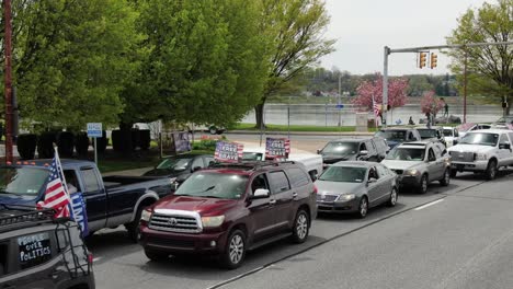 Land-of-the-free-because-of-the-brave,-people-over-politics,-Harrisburg-coronavirus-COVID-protesters-line-streets