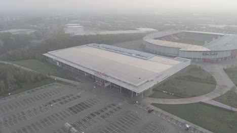 North-West-Tesco-retail-and-Saints-rugby-stadium-misty-aerial-morning-during-covid-corona-lock-down