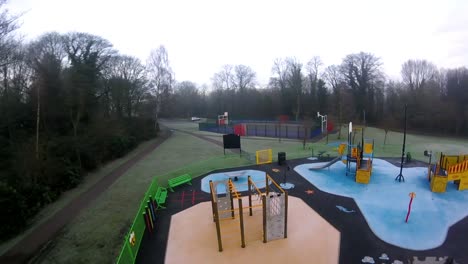 Recreational-colourful-children's-spooky-empty-playground-FPV-slow-motion-flying-aerial-view