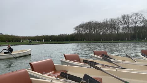 Different-views-of-the-bobbing-boats-on-the-Fountains-of-Versailles,-next-to-the-Palace-of-Versailles