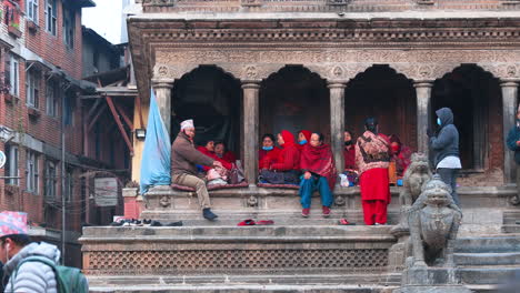 Community-choir-group-sings-devotional-songs-with-a-religious-theme,-also-known-as-Bhajan-in-the-local-language,-at-Krishna-Temple-in-Kathmandu,-Nepal