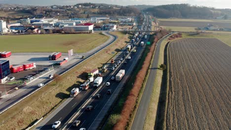 Aerial-view-of-highway-accident,-firefighters-assist-removing-vehicles