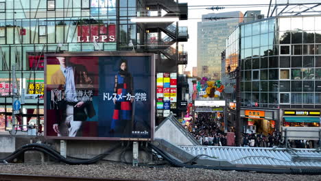 Arriving-at-Harajuku-station-from-a-yamanote-train-in-slow-motion-at-golden-hour-in-Tokyo,Japan