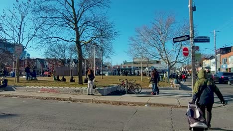 A-busy-spring-day-in-Kensington-Market-at-Bellevue-Square-Park,-Toronto