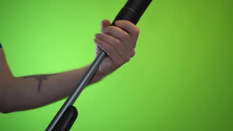 Mounting-a-silencer-on-a-single-barrel-shotgun-weapon-on-green-screen