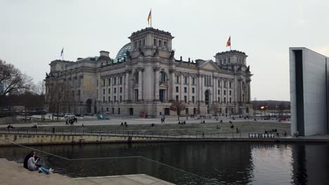 Locals-Chill-on-Stairs-in-Government-District-of-Berlin-at-River-Spree