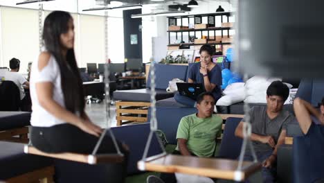 Employees-at-a-trendy-startup-office-watch-a-group-presentation