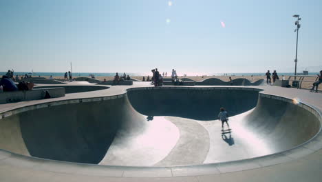 Skateboarder-does-Trick-Jumps-at-Venice-California-Skate-Park-on-Sunny-Day-in-Los-Angeles