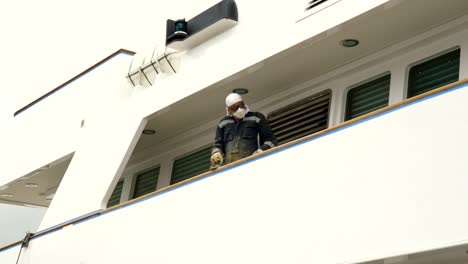 Varazze,-Italy---11-june-2019:worker-repairs-ship-with-sander-in-the-port-of-Varazze,Maintenance-concept