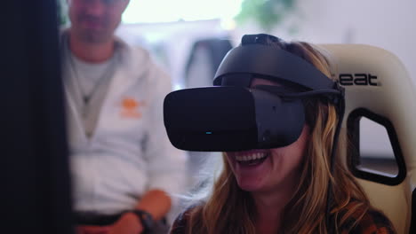 Close-up-of-smiling-Girl-playing-futuristic-game-and-wearing-modern-vr-helmet-with-glasses