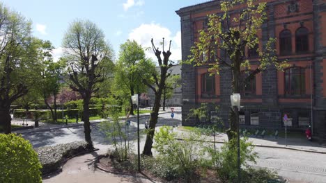 Sæverud-monument-in-Bergen-city-park---Flying-through-the-monument-and-ascending-up-to-city-overview