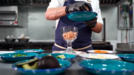 Preparing-shrimp-cocktail-in-big-glass-cup-slider-shot