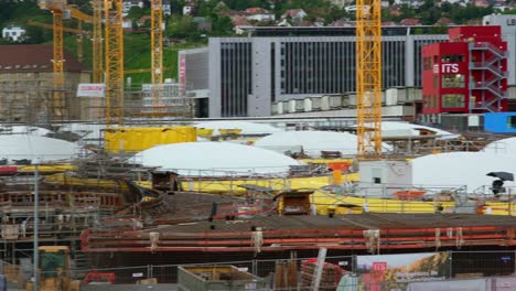 Stuttgart-21-massive-building-site-train-station-in-Germany-Overview-pan-cloudy-day