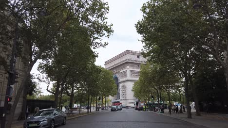 Shot-From-the-Side-of-The-Arc-De-Triomphe-Getting-Wrapped-by-huge-Crane,-Artwork-From-The-Artists-Christo-et-Jeanne-Claude,-Paris-France