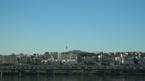 Seoul-Cityscape-of-Yongsan-gu-District-around-N-Seoul-Tower---iconic-Landmark-building-at-bright-cloudless-blue-sky-day,-South-Korea