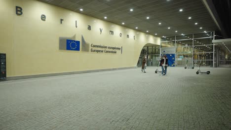 Girl-posing-at-the-entrance-of-the-European-Commission-in-Brussels,-Belgium