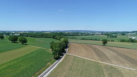 An-Aerial-View-of-Thomas-the-Tank-Engine-Arriving-in-the-Distance-by-It's-Self-Rounding-a-Curve-in-the-Track-on-a-Beautiful-Day