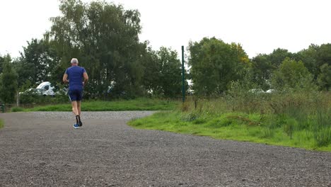 man-running-on-pathway-out-of-frame