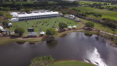 High-Wide-circling-flyover-of-equestrian-park-in-Wellington,-Florida