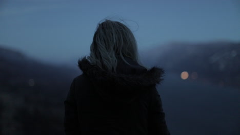 A-girl-gazes-out-at-a-gorge-from-a-scenic-viewpoint