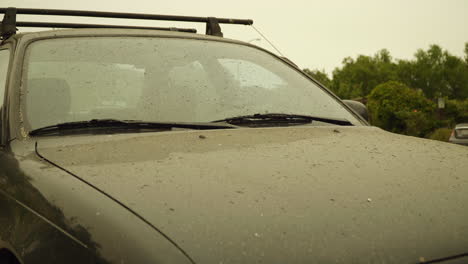 Car-Hood-and-Windshield-Covered-in-Ash