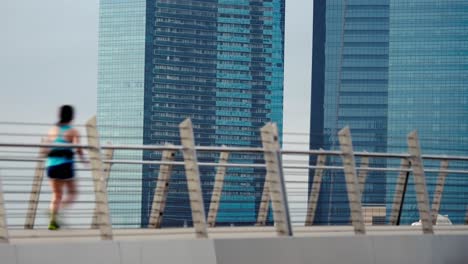 Early-morning-joggers-running-against-a-backdrop-of-modern-office-blocks