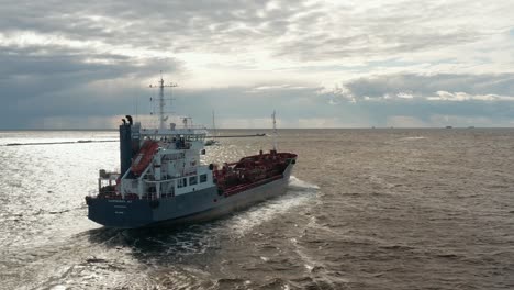 Aerial-view-of-a-ship-leaving-the-port-and-entering-open-sea