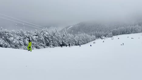 People-at-closed-T-bar-lift-having-fun-on-ski-slope