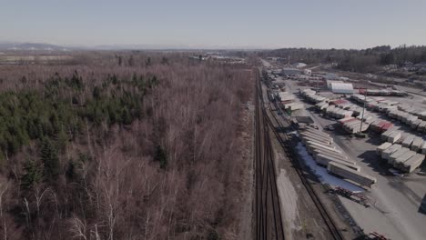 Aerial-sideways-view-of-containers-dock-in-Vancouver-shipping-terminal,-Canada