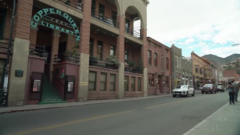 Cars-drive-by-and-tourists-walk-on-the-sidewalks-on-Main-St